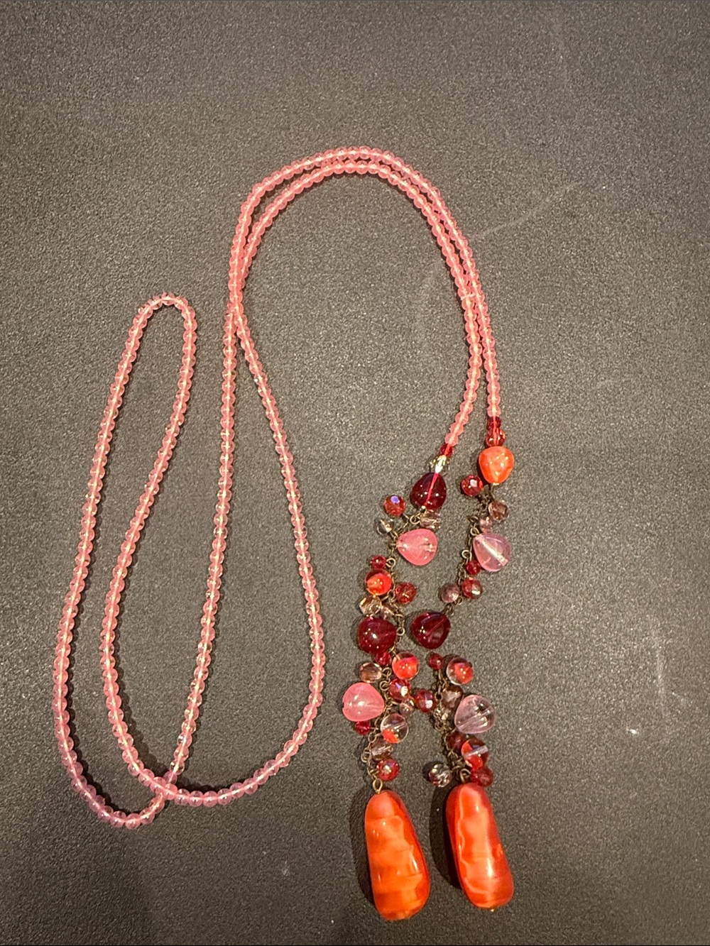 Vintage Lariat orange, red and pink glass stones.
